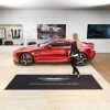 Large logo door mat in car showroom