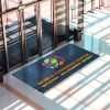Large logo doormat by conference entrance door